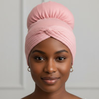 Woman wearing a mauve Afrona with knitted head warmer