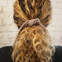 Quickly tie up your straight curly braided hair without leaving dents or kinks